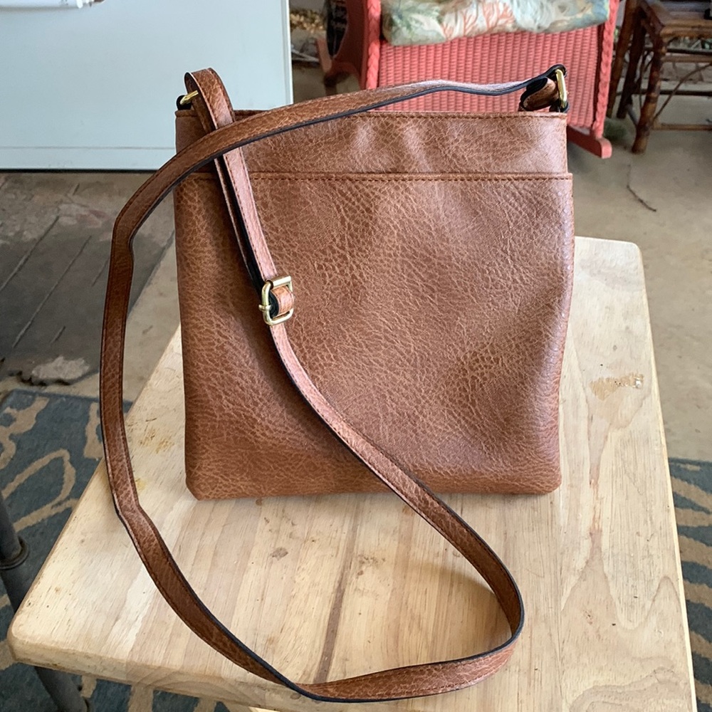 Crossover bag only used a few times. Great compartments
